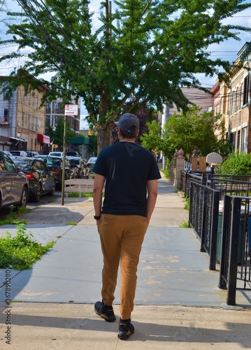 young man in front of a building