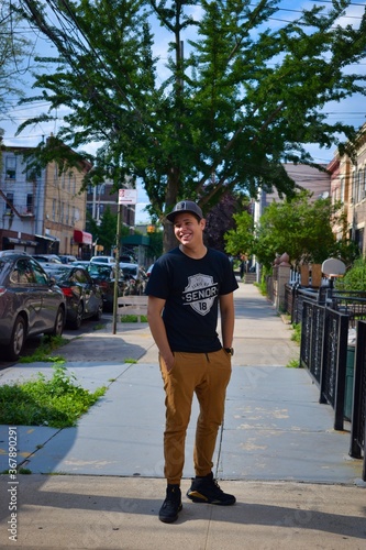 young man in front of a building