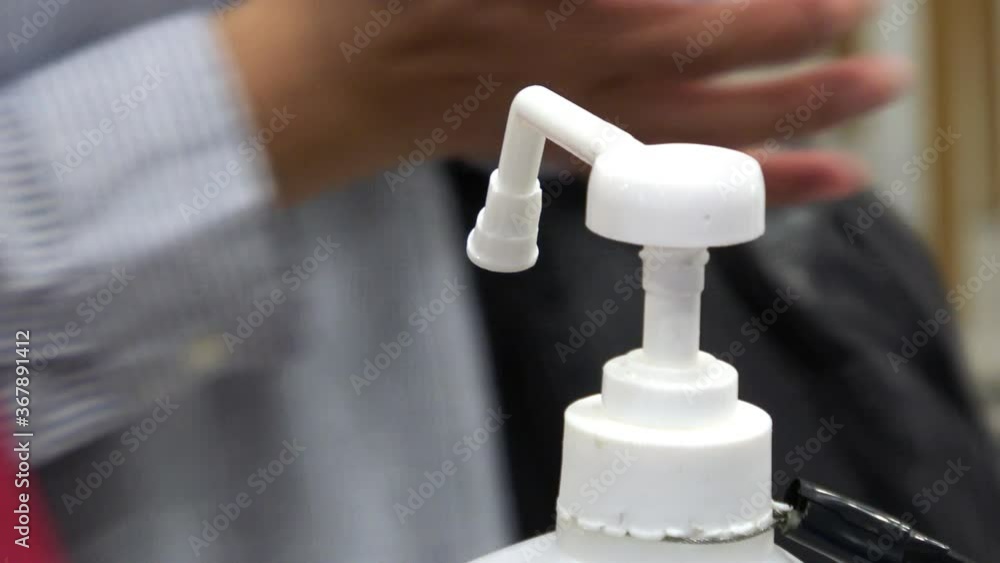 手指消毒 感染症予防対策 新しい生活様式 接写 4K / Close up shot of people sanitizing hands at a store in Japan. 4K. Preventive measure for COVID-19 in a public place. New normal. 手指消毒 感染症予防対策 新しい生活様式 接写 4K / Close up shot of people sanitizing hands at a store in Japan. 4K. Preventive measure for COVID-19 in a public place. New normal.
