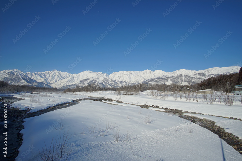 Daytime landscape of snowed mountains in northern alps of Japan, Hakuba