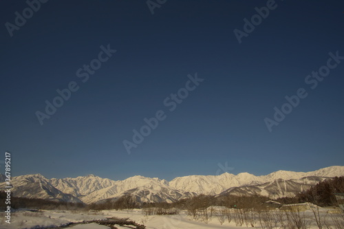 Daytime landscape of snowed mountains in northern alps of Japan  Hakuba