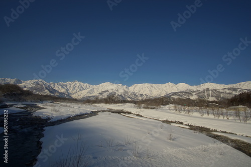 Daytime landscape of snowed mountains in northern alps of Japan, Hakuba