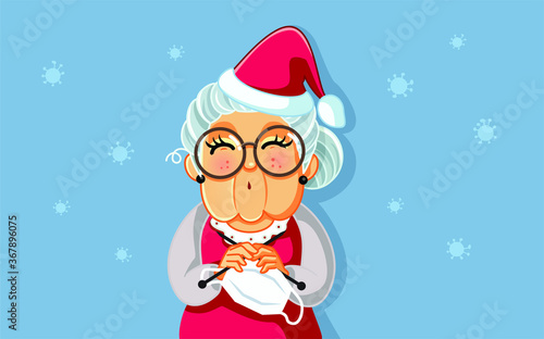 Mary Claus Knitting Face Mask for Santa During Health Crisis