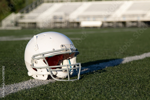 white blank helmet, american football helmet on grass © Don Mroczkowski