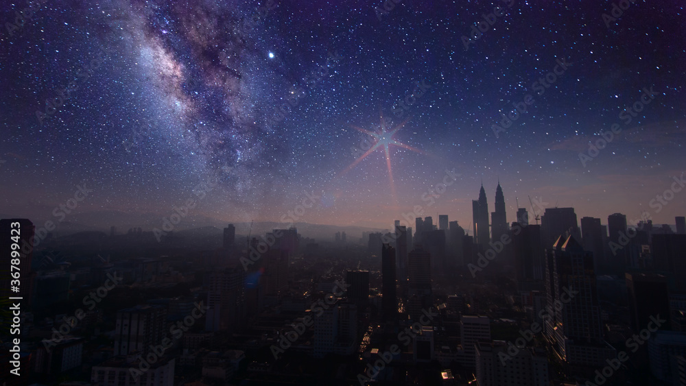 Milky Way Galaxy rising in Kuala Lumpur City. Image contain Noise and Grain due to High ISO. Image also contain soft focus and blur due to Long Exposure and Wide Aperture. 