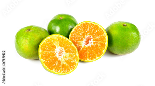 Orange fruit half and two segments isolated on white background