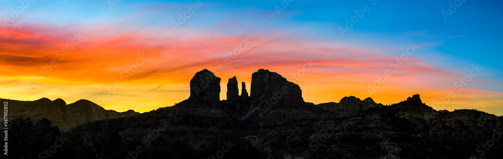 Sedona Sunrise - An iconic rock formation, Cathedr4al Rock, is silhouetted by a beautiful sunrise sky in Sedona, Arizona in the beautiful Southwest of America.