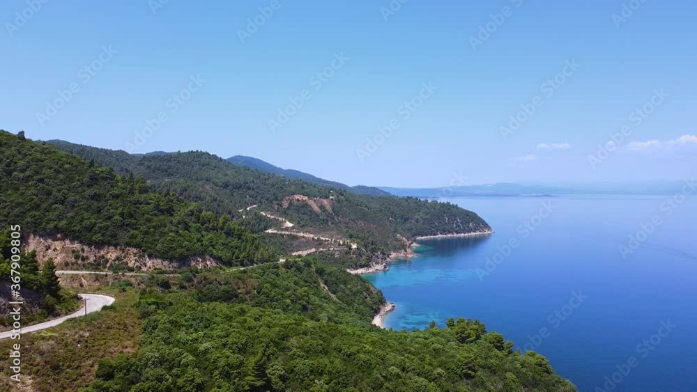 Road on the hill on sea coast with view to turquoise clear sea. Aerial view Road on the hill on sea coast with view to turquoise clear sea. Aerial view
