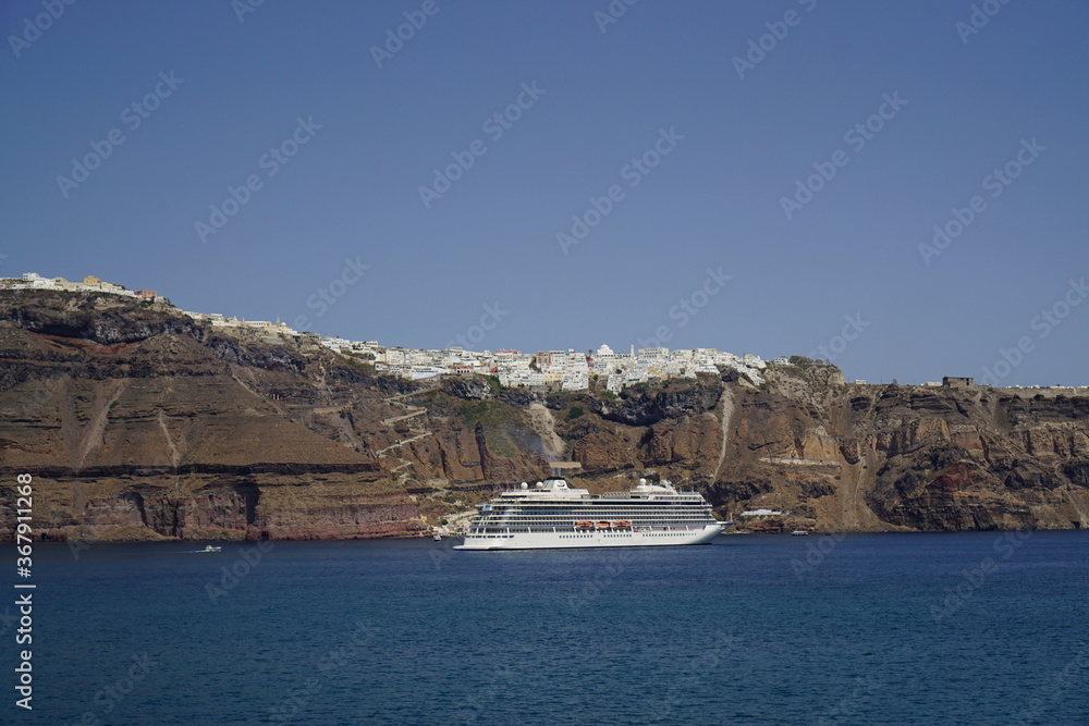 the town on the cliff and the ferry, Santorini island in Greece, Europe