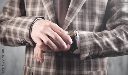 Businessman wearing luxury wristwatch. Fashion, Lifestyle © andranik123