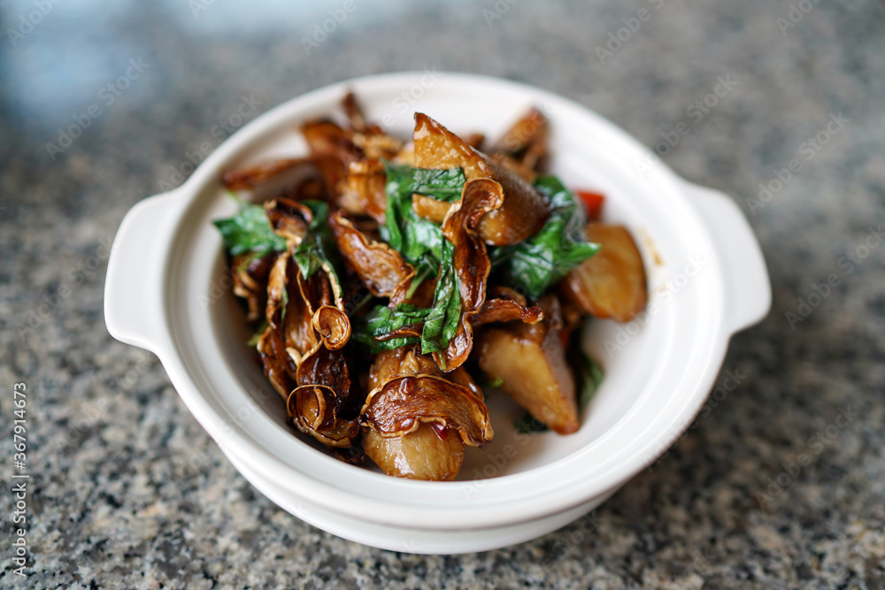 Homemade Abalone mushrooms with spicy sauce in clay pot. Homemade Abalone mushrooms with spicy sauce in clay pot.