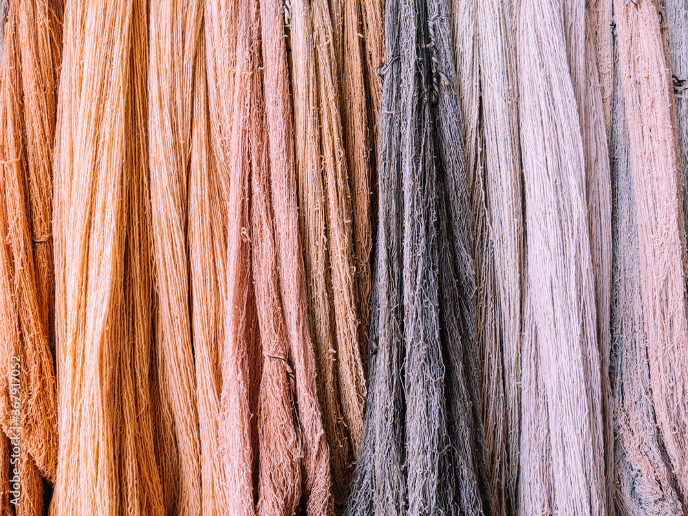 Close-up of dyed cotton yarns by nature color Close-up of dyed cotton yarns by nature color