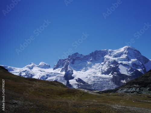 A picture of a tourist trail touring the beautiful nature trekking route of Matterhorn mountain nature tour in Switzerland, August 15, 2015.