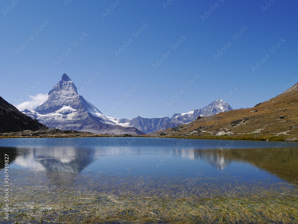 A picture of a tourist trail touring the beautiful nature trekking route of Matterhorn mountain nature tour in Switzerland, August 15, 2015.