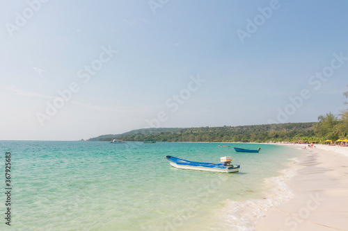 Fototapeta Naklejka Na Ścianę i Meble -  A small boat at the beach of Koh Rong Island, Cambodia
