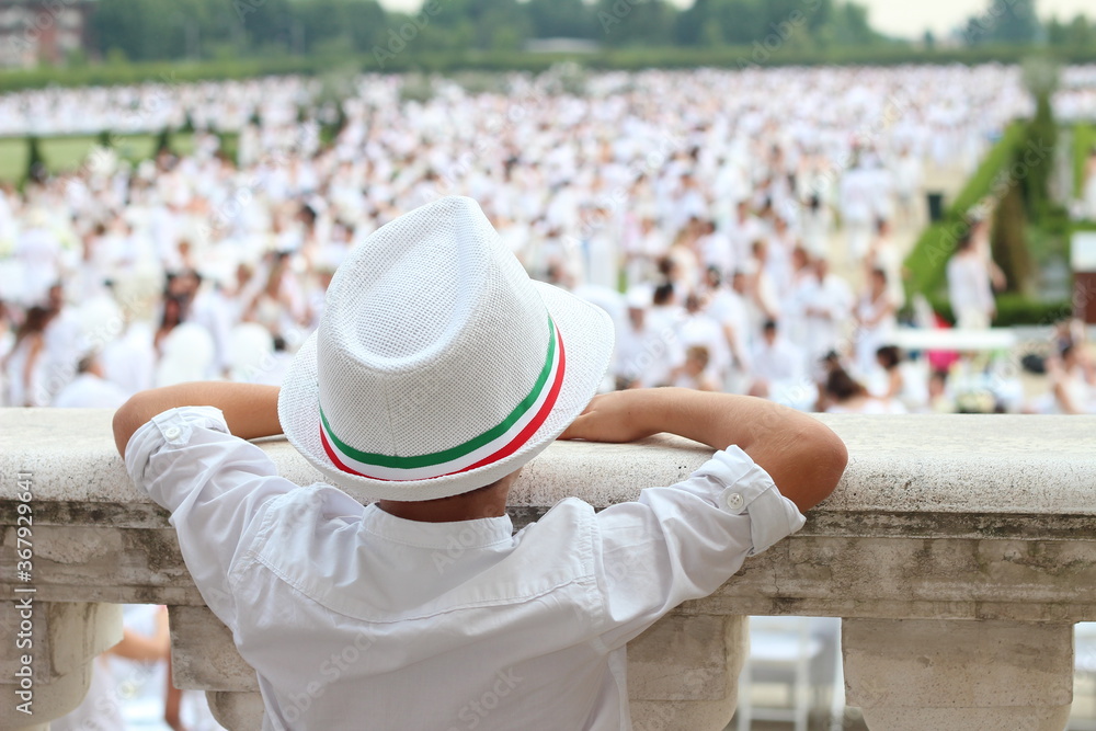boy with hat dressed in white boy with hat dressed in white