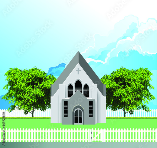 Rural Christian parish church building with white picket fence and gate set against a blue cloudy sky