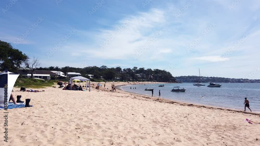 Main Beach in Bundeena Sydney Australia. Autumn day with a couple of people relaxing at the beach SYD Australi Main Beach in Bundeena Sydney Australia. Autumn day with a couple of people relaxing at the beach SYD Australi