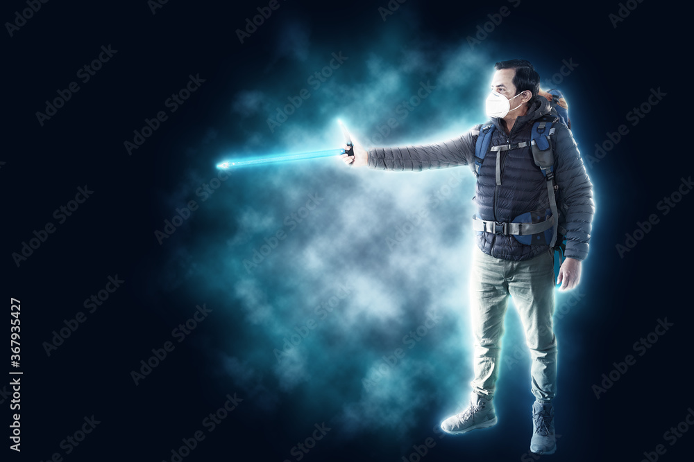 A man wear face mask and ice ax hiking to the top of mountain and carrying big backpack A man wear face mask and ice ax hiking to the top of mountain and carrying big backpack
