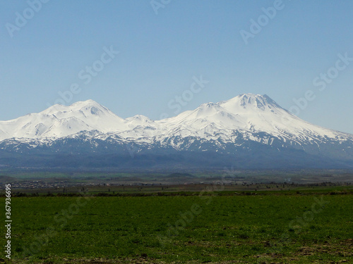 Panoramic Cappadocia landscape view of Mount Erciyes in countryside in spring season, the highest mountain in Cappadocia in Turkey.