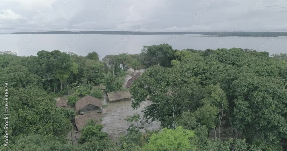 Indigenous tribe in the Amazon Jungle aerial shot Indigenous tribe in the Amazon Jungle aerial shot