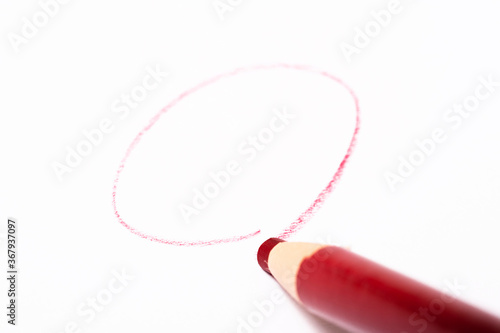 Red pencil with line over white background 