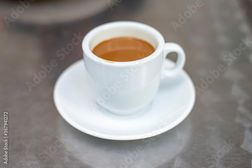 cup of coffee on metal table