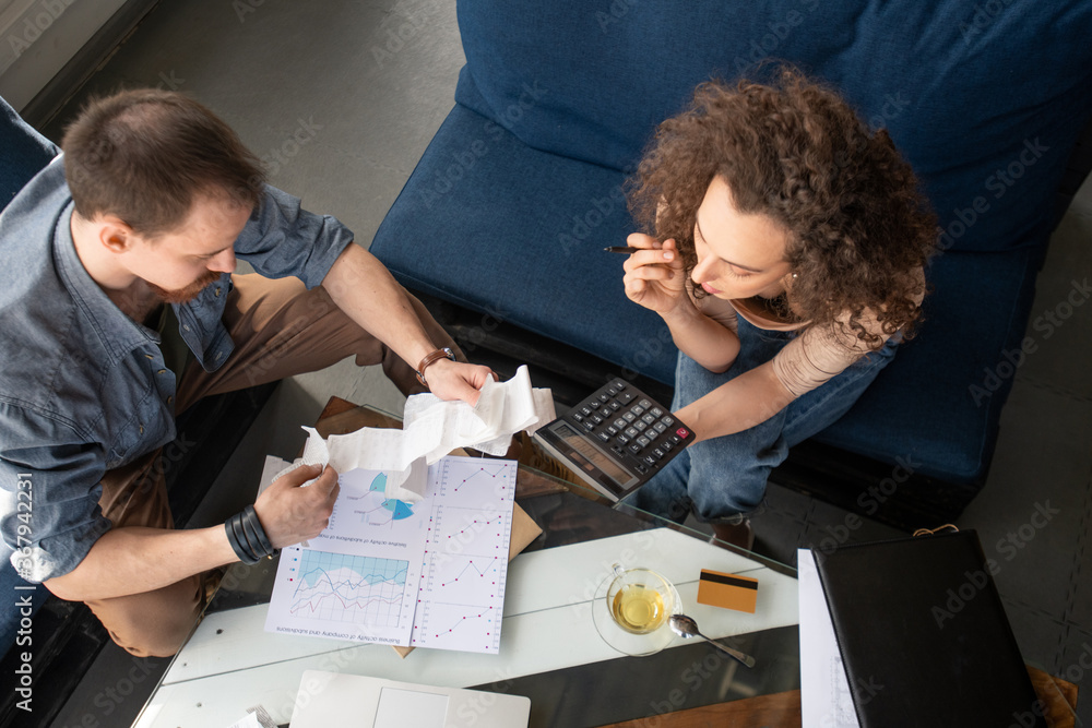Content pretty girl with curly hair sitting in cozy cafe and using laptop while interacting on social media, dating website Content pretty girl with curly hair sitting in cozy cafe and using laptop while interacting on social media, dating website