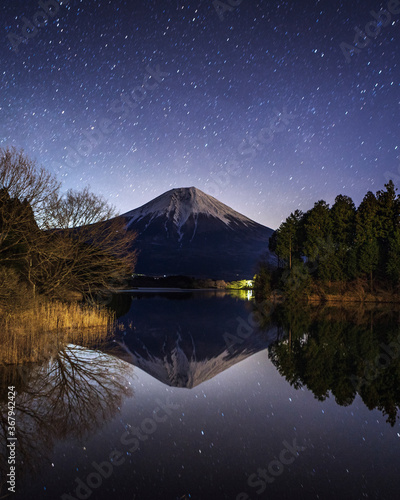 Reflection of Mount Fuji in the lake with the star in the sky