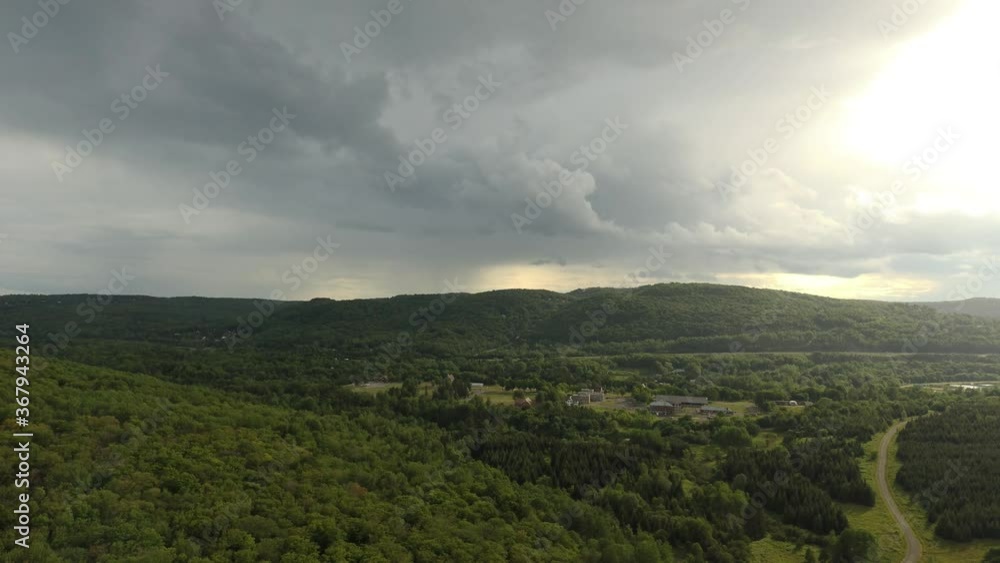 Spectacular cloud and skies viewed by drone flying slowly over countryside Spectacular cloud and skies viewed by drone flying slowly over countryside