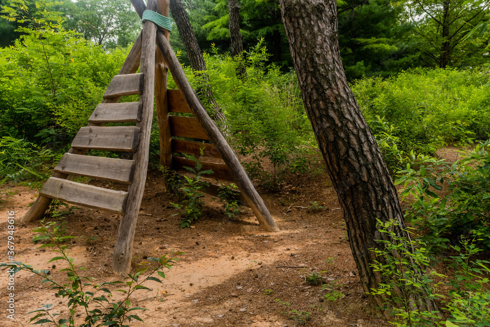 Wooden teepee shaped climbing apparatus. Wooden teepee shaped climbing apparatus.