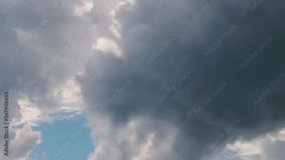 Cloudscape after rain with dark clouds and sunny blue sky. Background symbolizing climate change, complexity and faith worship christian concept. High quality FullHD nature footage. Cloudscape after rain with dark clouds and sunny blue sky. Background symbolizing climate change, complexity and faith worship christian concept. High quality FullHD nature footage.