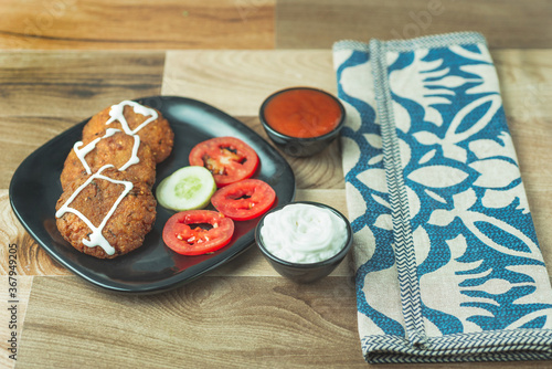 Fototapeta Naklejka Na Ścianę i Meble -  Vegetable cutlet is a popular snack on the Indian restaurant menus. Crumb coated and pan fried. They taste great with a crisp texture. Cutlet are best served hot with some green or red chutney.