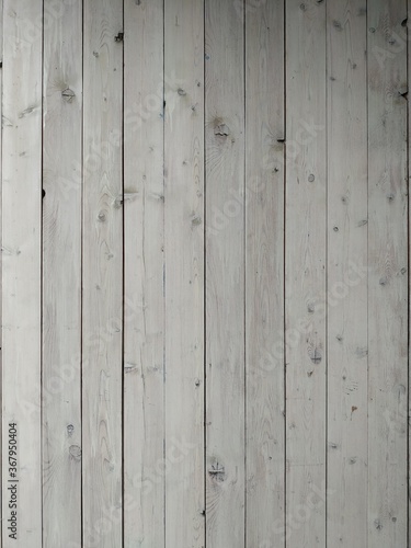 A surface of white worn out wooden boards in horizontal position. for vintage backgrounds