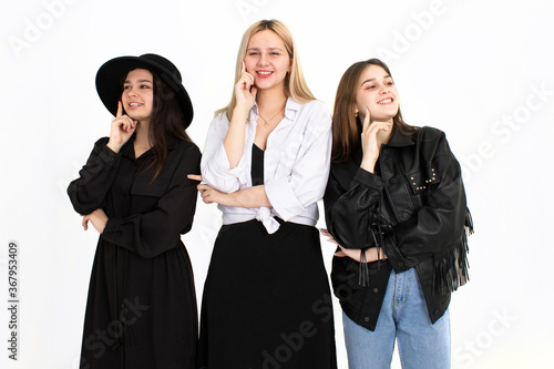 Three young beautiful girls are thinking about solving the problem