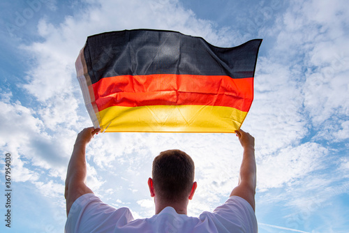 Man holding Flag of Germany, concept picture