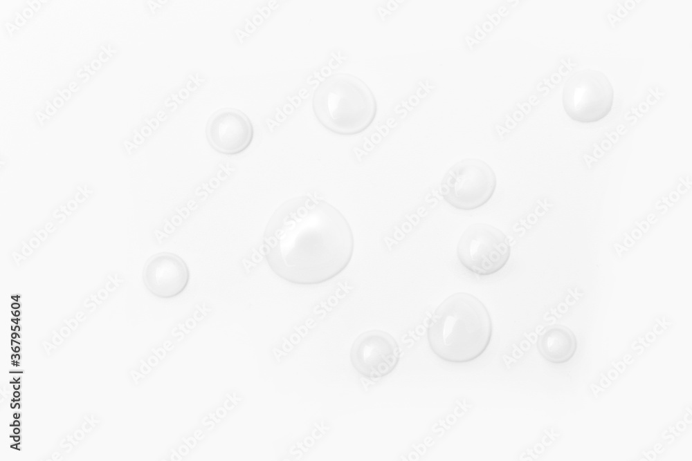 drops of water on a white background, top view