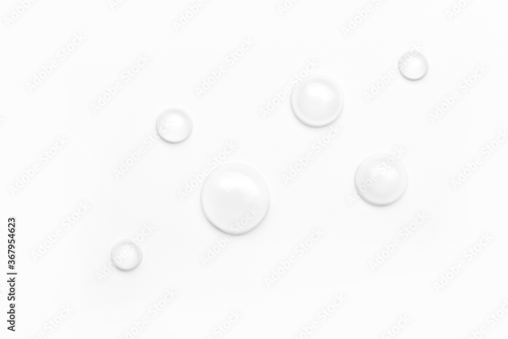 drops of water on a white background, top view
