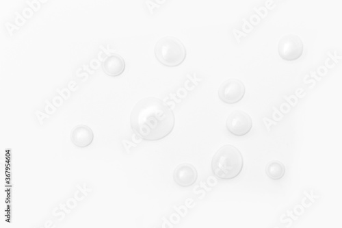 drops of water on a white background, top view