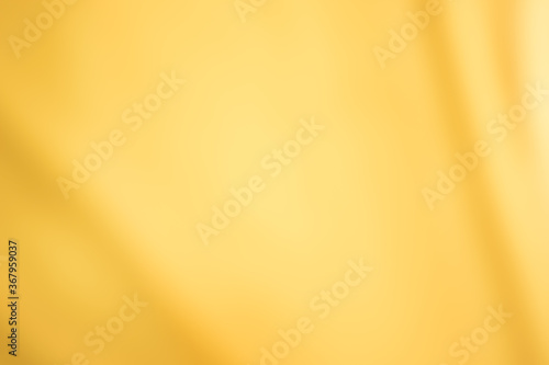 Golden yellow cotton fabric for a soft and smooth background. Elegant graphics.