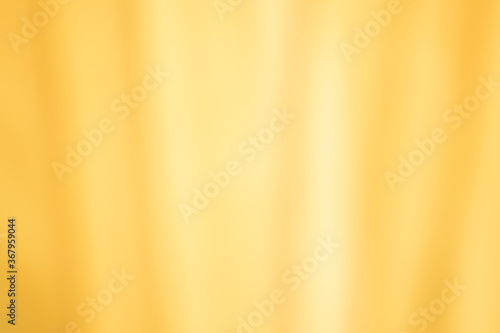 Golden yellow cotton fabric for a soft and smooth background. Elegant graphics.