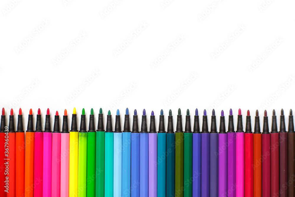 A set of markers on a white background with space for text. Creative classes with children at home and at school, stationery for an art master class, the concept of creative development... Flatlay A set of markers on a white background with space for text. Creative classes with children at home and at school, stationery for an art master class, the concept of creative development... Flatlay