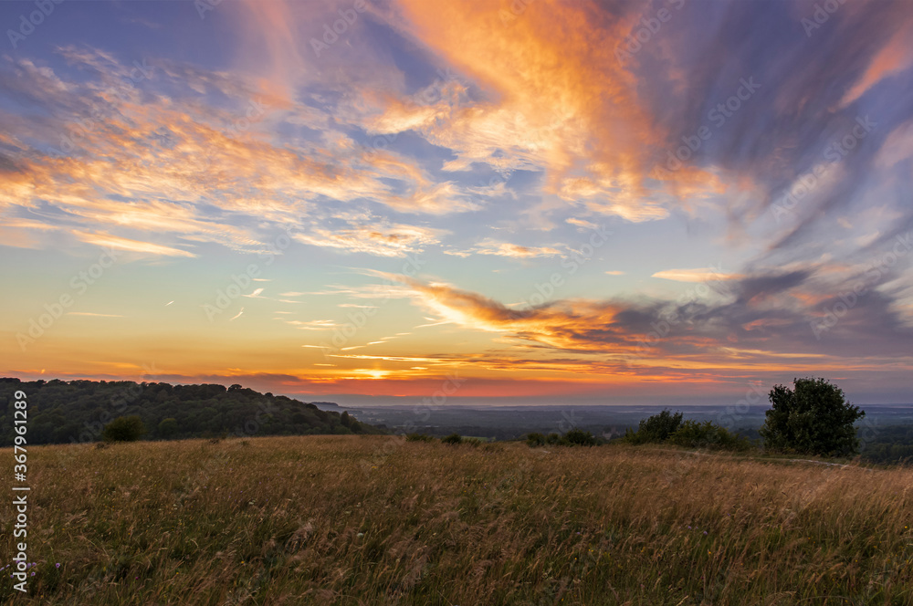 Summer sunset over the North Wessex downs from Beacon hill in Hampshire south east England UK