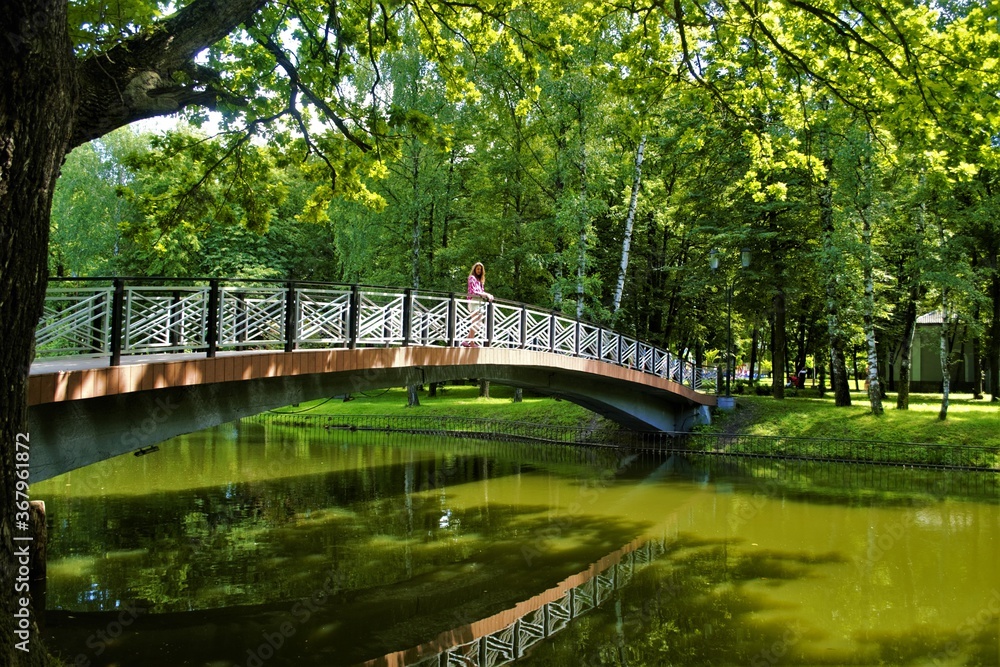 
girl on the bridge in the park
