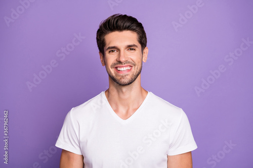 Close-up portrait of his he nice attractive content cheerful cheery guy sales manager worker freelancer isolated over bright vivid shine vibrant lilac violet purple color background