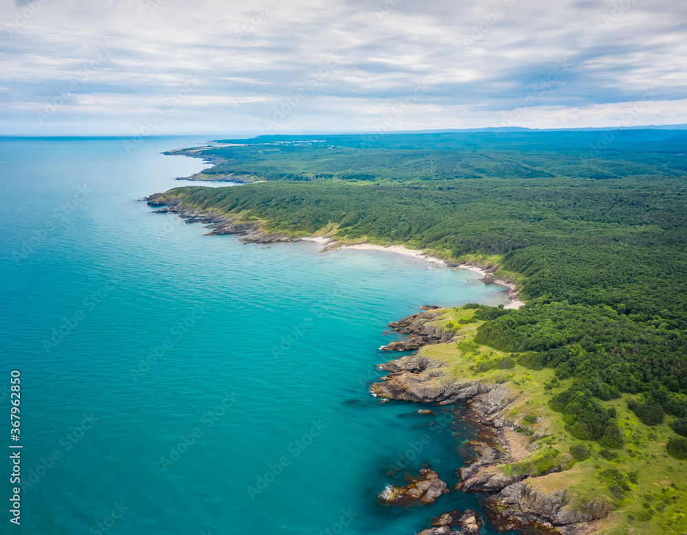 Aerial panoramic view of the wild beaches, surrounded by rocks and green dense forests on the southern Black Sea coast, Bulgaria. Aerial panoramic view of the wild beaches, surrounded by rocks and green dense forests on the southern Black Sea coast, Bulgaria.