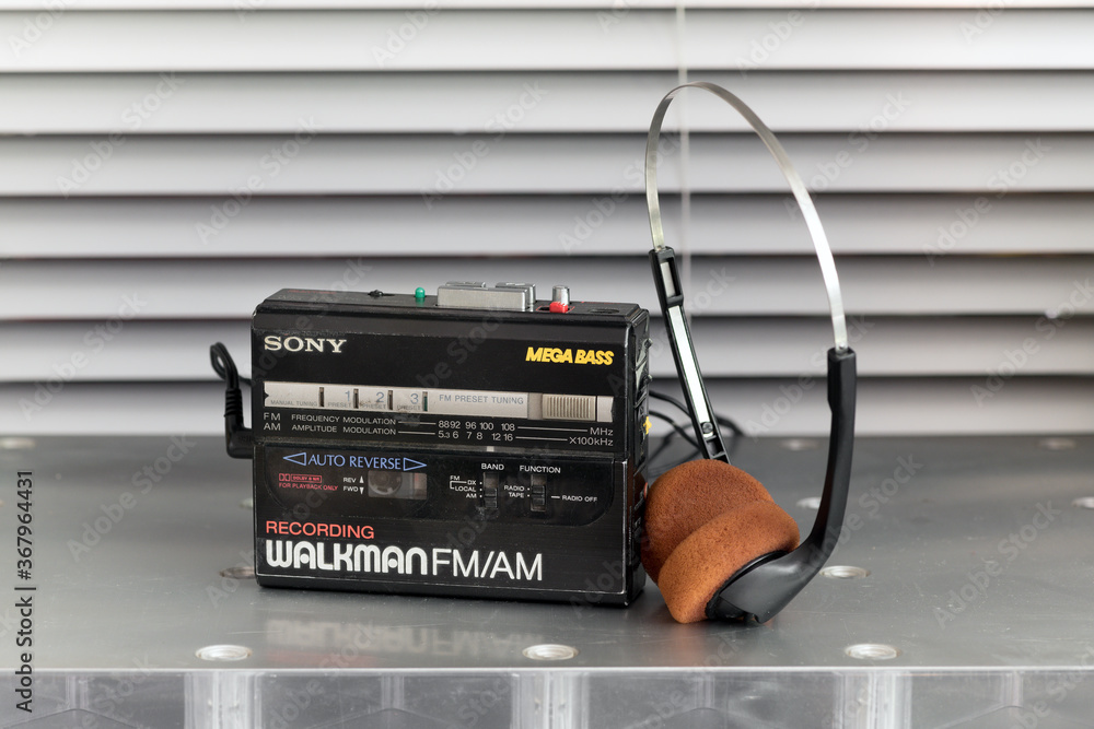 Vintage Walkman cassette player and headphones Photos | Adobe Stock