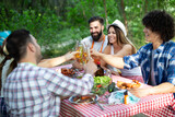Small group of friends having fun at barbecue party