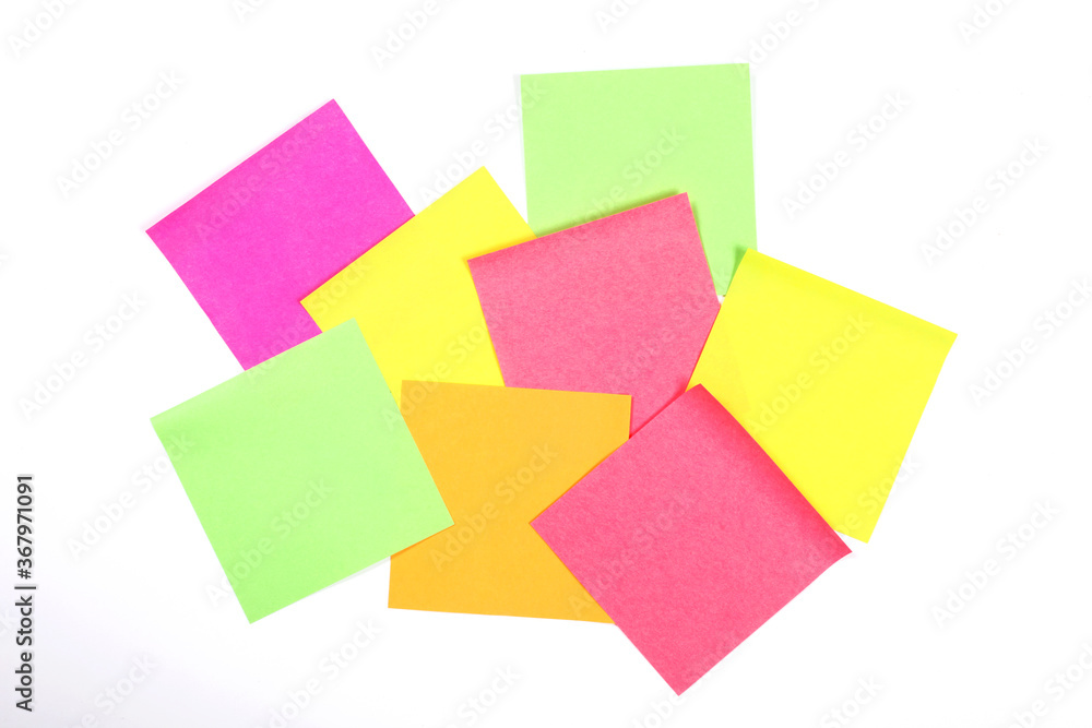 group of blank colorful paper sticky notes isolated on white wall with copy space for your text