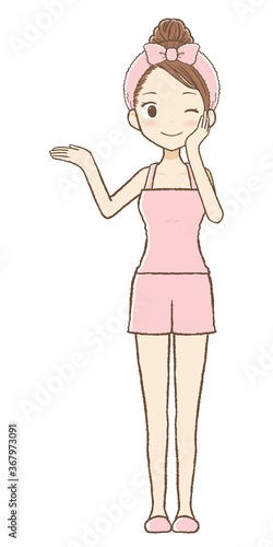 右手を上げて案内するルームウエア女性　ウィンク